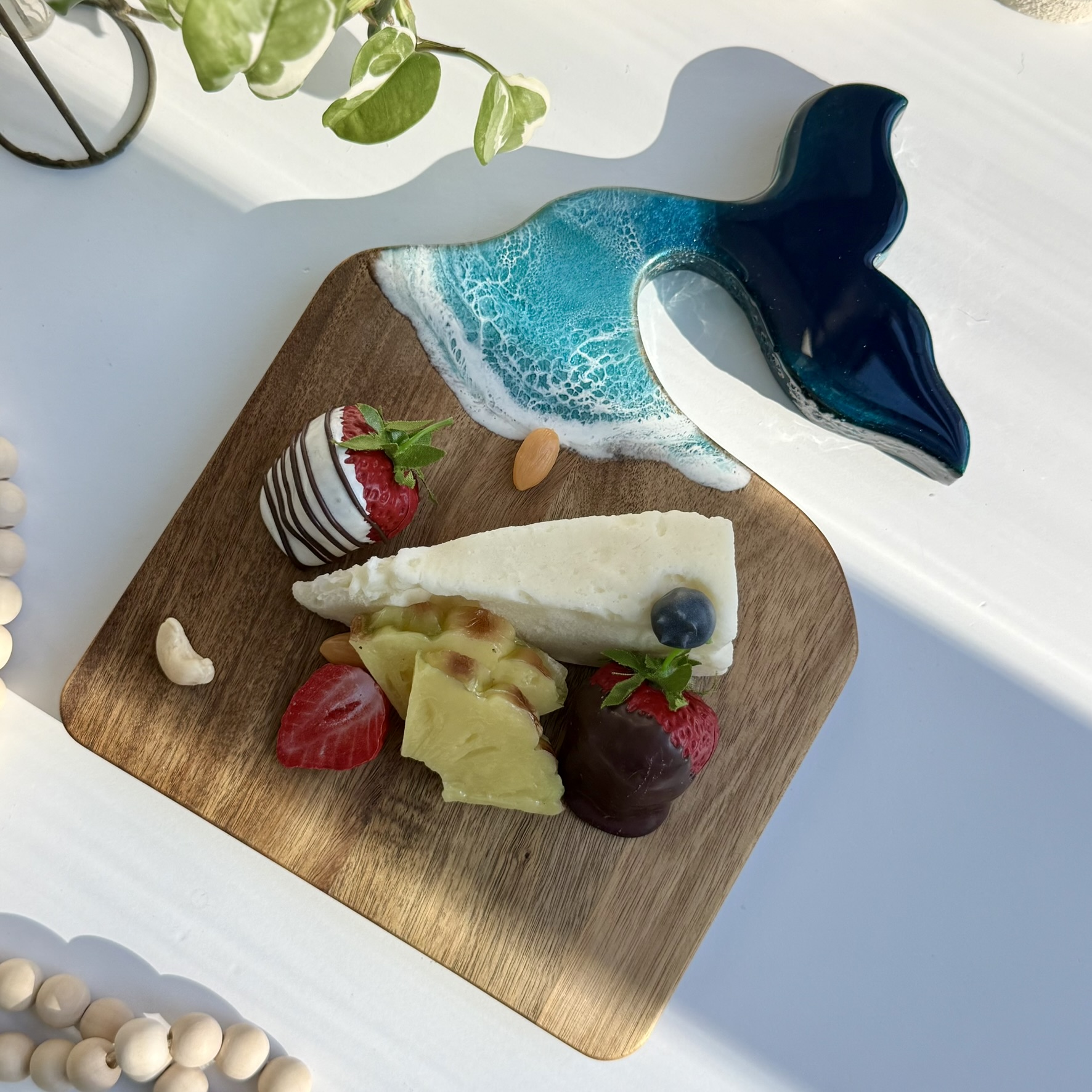 Whale Tail Charcuterie Board with Ocean Resin Art – Handcrafted Coastal Serving Tray Handcrafted whale tail charcuterie board with ocean wave resin art on natural wood, styled as a coastal-inspired serving tray.