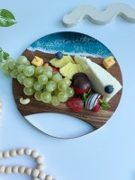 Mini handmade cheese board with ocean resin wave design and metal handle, crafted from wildfire-rescued wood, eco-friendly, customizable with engraving, and gift-wrapped.